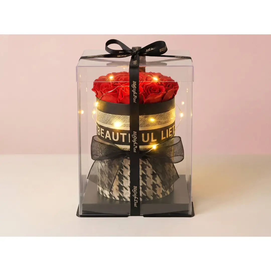 Luxe rozenbox met rode rozen, LED verlichting, zwarte strik en transparante geschenkverpakking